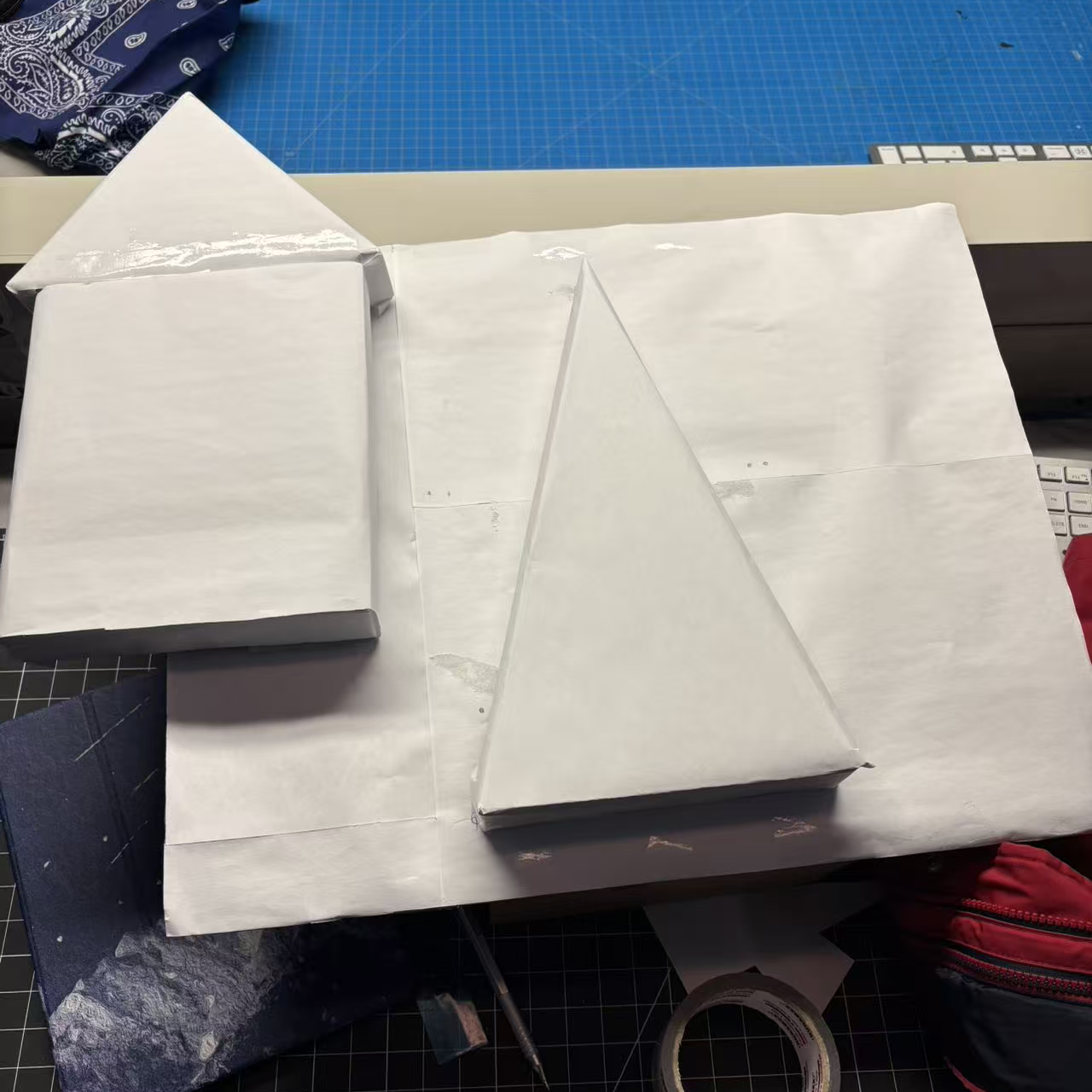 The paper prototype of the Christmas tree and house.